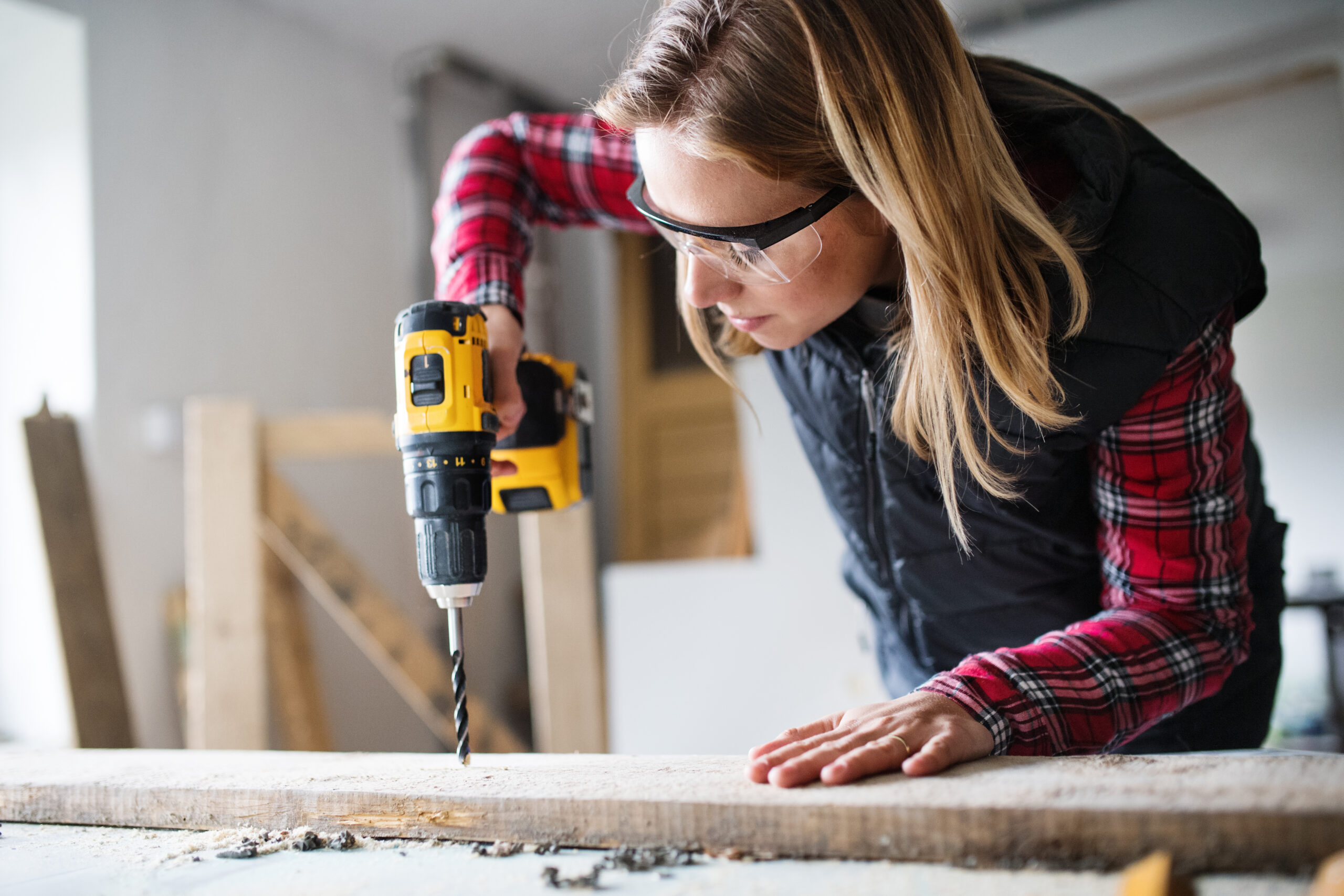 Young,Woman,Worker,In,The,Carpenter,Workroom.